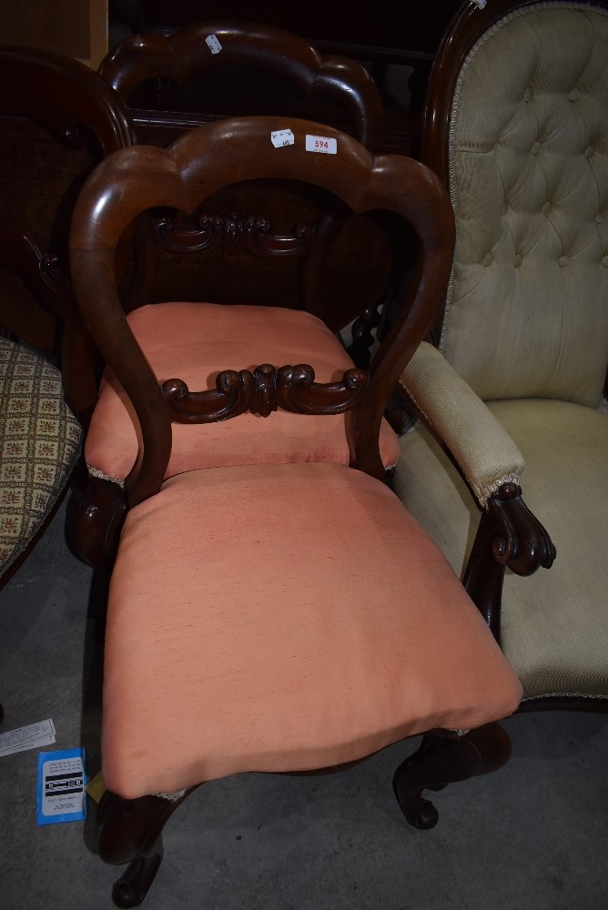 Two matching carved balloon back chairs having mahogany frames and similar chair