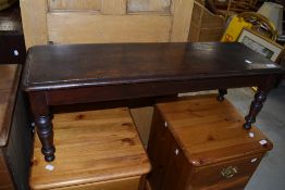 A 19th Century mahogany duet stool having solid seat on turned legs