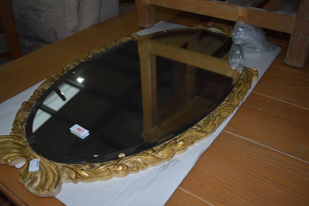 A vintage gilt frame oval wall mirror