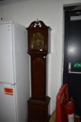 A long cased clock having brass dial and reading Tempus , of small proportions