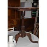 A 19th Century mahogany occasional table having circular top, turned column and triple splay legs,