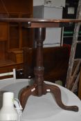 A 19th Century mahogany occasional table having circular top, turned column and triple splay legs,