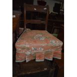 A traditional dining chair having carved rail back with turned legs in mahogany