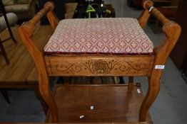 An antique piano stool having art nouveau decoration