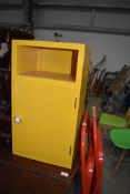 A vintage painted ply bedside cabinet, in yellow