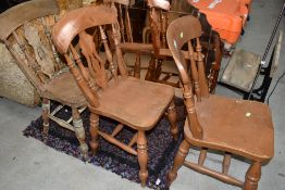 A set of three traditional pine and yew wood seats with vase back and turned frames