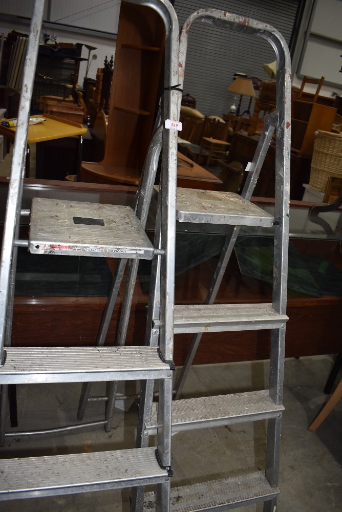 Two pairs of modern light weight metal step ladders