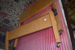 An early to mid 20th Century oak and ply bed frame and base