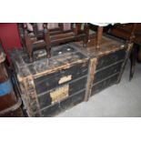A vintage travel trunk or bedding box having distressed paint work with badges for blue star etc W50
