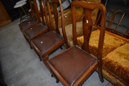 A set of four shield back dining room chairs having beech wood frames with maple backs