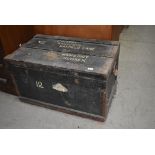 A vintage shipping trunk, worn labels