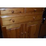 A modern pine cabinet, two over one drawer and lower cupboard section