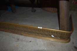 A Victorian fire guard or fender having pierced fretwork body