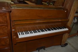 A six and a half octave up right piano in great condition by Bently Resonoura serial 103463