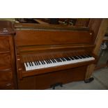 A six and a half octave up right piano in great condition by Bently Resonoura serial 103463