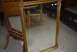 A reproduction gilt frame wall mirror