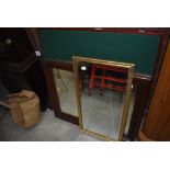 Two hall way mirrors and a foldaway card table