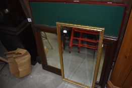 Two hall way mirrors and a foldaway card table