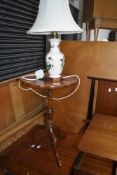 A reproduction wine table and a Masonware table lamp