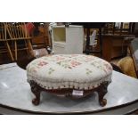 A small well carved mid 18th century foot stool