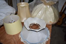 A selection of light and lamp shades including shaped and draped examples