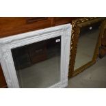 Two reproduction wall mirrors