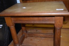 A traditional oak coffin stool style occasional table