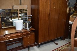 A vintage bedroom suite by E Gomme, G Plan, compsrising wardrobe, dressing table, double bed frame