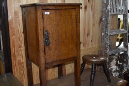 An early 20th Century oak pot cupboard