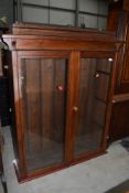 A stained frame bookcase top