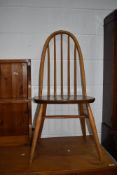 A light Ercol hoop and stick back kitchen chair