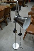 A stainless steel angle poise standard lamp