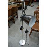 A stainless steel angle poise standard lamp