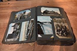 A vintage Postcard Album containing several hundred cards of Canada, GB, New Zealand etc, good cards