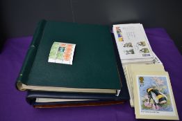 A collection of GB First Day Covers loose and in album, 1970's onwards, three Coin Covers, album and