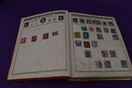 A vintage Empire Postage Stamp Album containing World Stamps including Commonwealth, mainly early