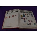 A vintage Empire Postage Stamp Album containing World Stamps including Commonwealth, mainly early