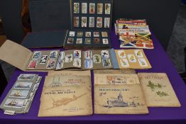 A large collection of Cigarette and Trade Cards in albums including Brooke Bond, Typhoo, Wills,