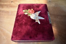 A Victorian photograph album, mainly of Rochdale Families, having bird and rose decoration and