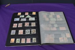 A Stock Book containing Indian Stamps, Queen Victoria to 1960's, mainly used