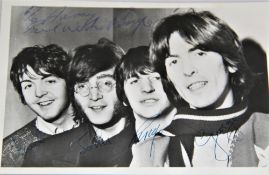 A Beatles signed photo - looks like 1965 / 1966 - dedicated to Harry - all four signatures present -