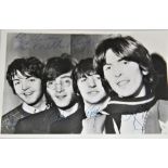 A Beatles signed photo - looks like 1965 / 1966 - dedicated to Harry - all four signatures present -