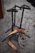 A selection of guitar stands, leads etc