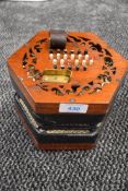 A traditional 48 button concertina, probably Lachenal late 19th/early 20th Century, some splitting