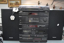 A Panasonic stackable Hi Fi unit and record player with speakers