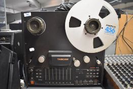 A Tascam TSR-8 8 channel reel to reel recorder and a Tascam RC-408 remote control