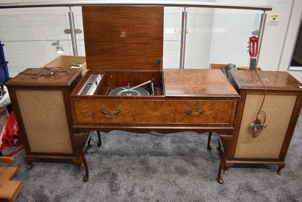 A vintage walnut cased Dynatron radiogram, on cabriole legs