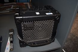 A Roland Micro cube small size practice amp