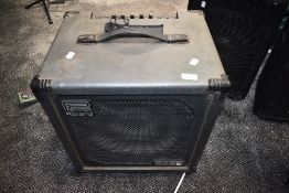 A Roland super cube 100 bass amp