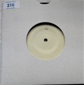 A white label Apple one sided test press of ' open your box ' by the Plastic Ono Band - been play